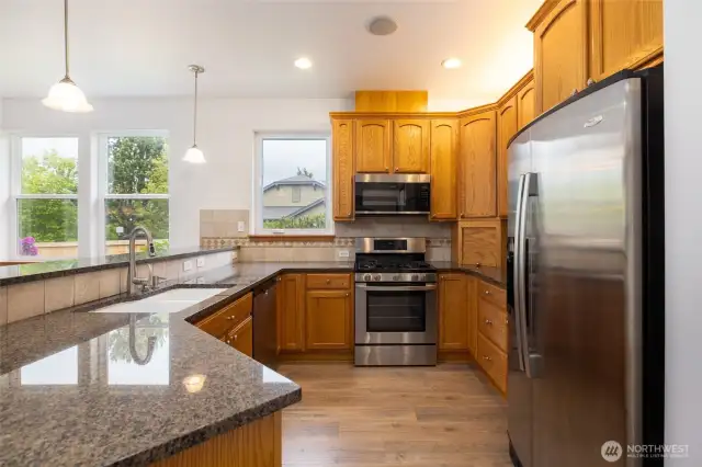 Kitchen with granite, lighting above cabinetry/under cabinetry