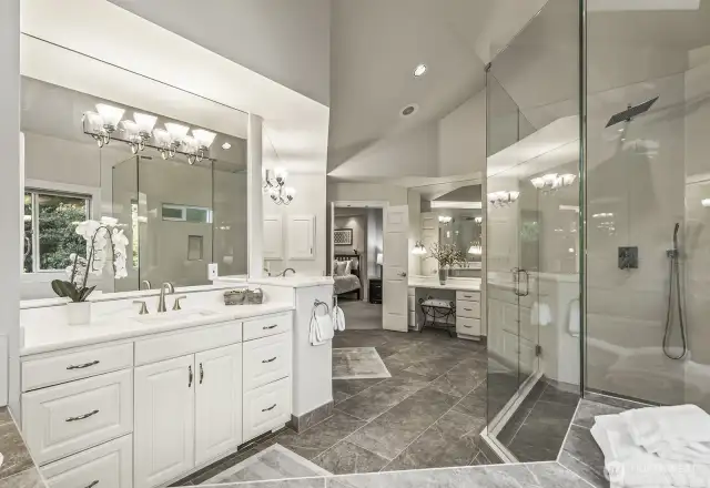 Updated 5 piece bathroom with designer tiled floor and shower, 2-person jetted tub, crisp white cabinetry with separate quartz vanities.