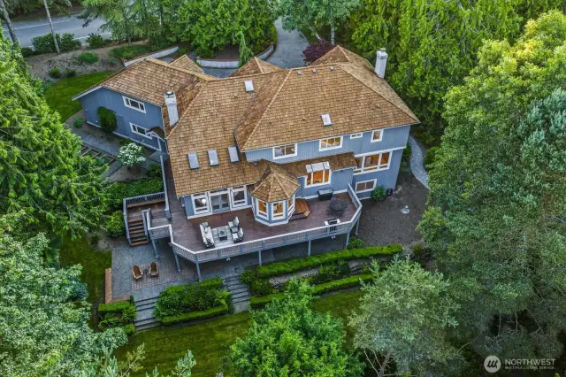 The 1.8 acre lot features extensive stonewalling, 3 dry riverbeds, gravel walk ways, 3 raised garden beds with irrigation, 120-V lighting, sprinklers, an electric outlet in the lower yard, invisible fencing and backs to greenbelt.