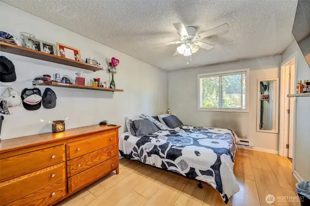 Primary bedroom with a private three quarter bath