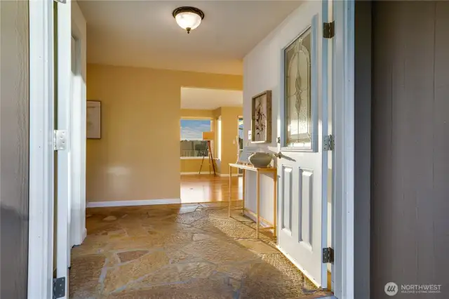 Courtyard entry with double doors and pristine flagstone begin your tour
