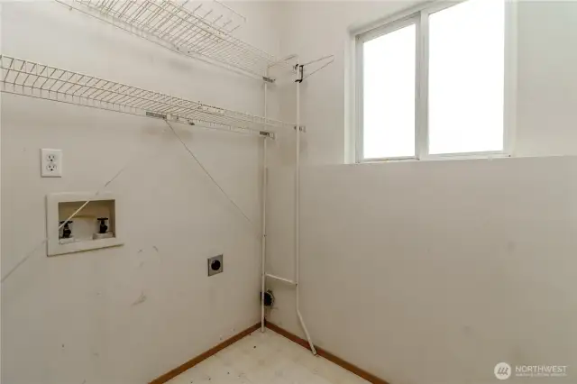 Laundry room attached to half bath and bonus room