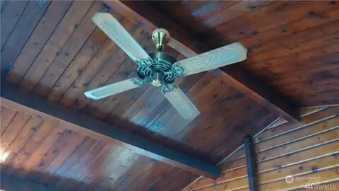 Vaulted ceilings in this cute Pan Abode log home.