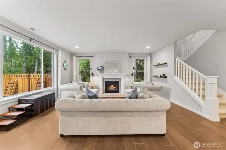 Gas fireplace in living room with lots of natural light