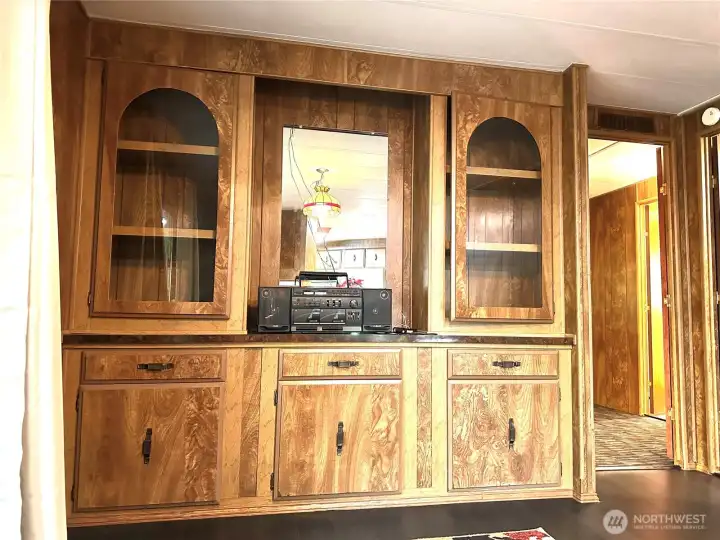 Built in storage in the dining room, there is additional built in storage off of the kitchen