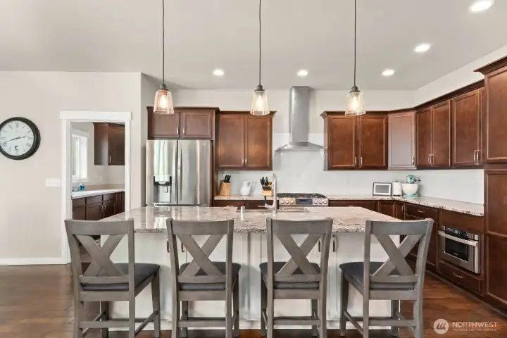 Kitchen with high end finishes and island with granite cou
