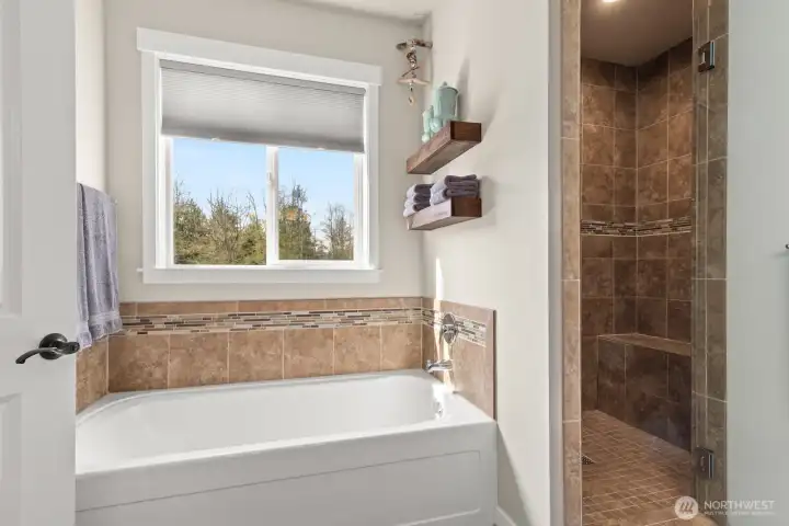Tiled shower and tub in master bathroom