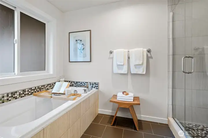 A deep soaking tub invites long, relaxing evenings of quiet retreat.