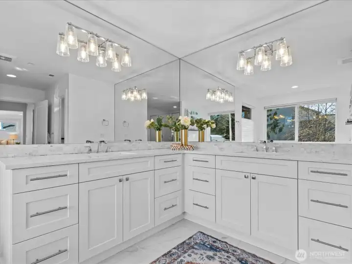 Sleek quartz counters, a classy tile backsplash and plenty of storage space