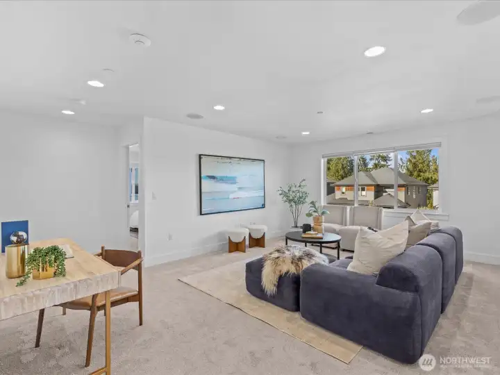 Upper level loft is the perfect media, bonus room or play space