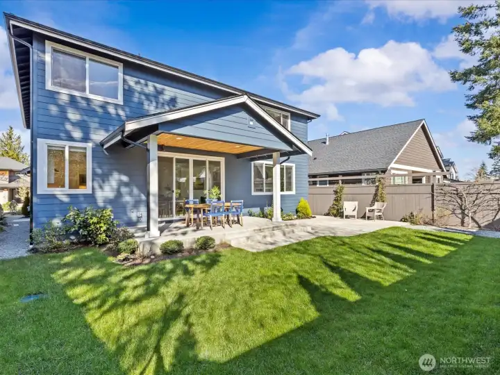 A manicured yard with fruit trees and delightful garden space. Covered and uncovered patio space offer room to relax or entertain