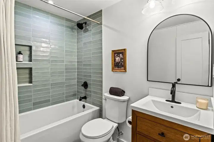 Elegant updated bathroom on main level - all pluming updated.