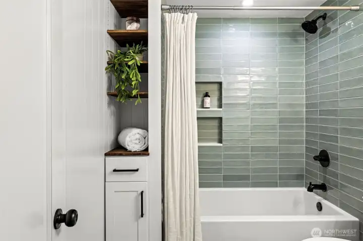 Elegant updated bathroom on main level - all pluming updated.