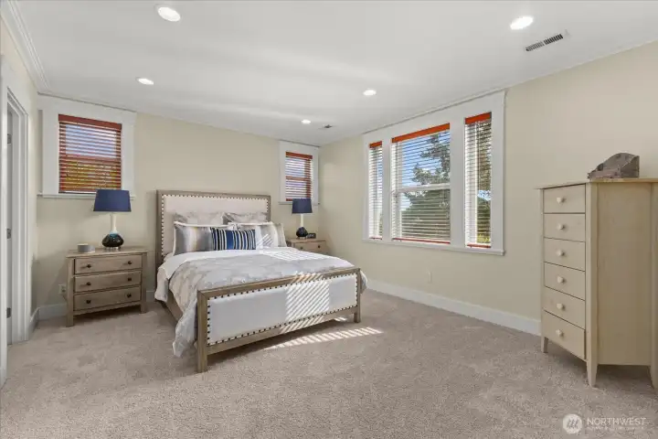 Primary bedroom with natural light and walk in closet