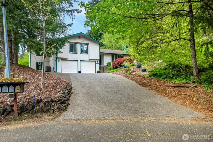 Large driveway with a bonus parking spot next to the garage