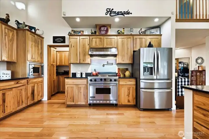 Surround yourself with hickory wood cabinets, galaxy granite counters and Viking stainless appliances!  SO NICE and spacious!  This is an entertainers dream!