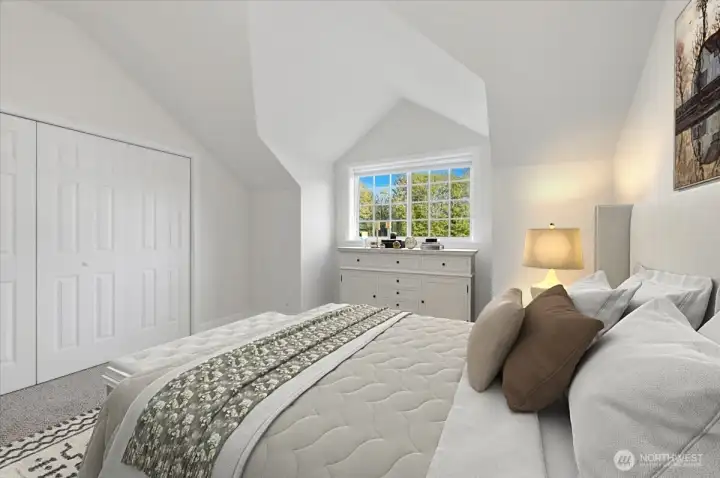 One of two upstairs bedrooms with vaulted ceilings and dormer windows!