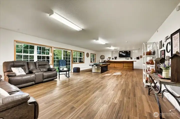 Step out to the spacious back yard that gently slopes down in to the trees~Plenty of room for your pets and littles to frolic Look at these porcelain tile floors! They are GORGEOUS and tough! Want to have a large gathering? More than plenty of room here!