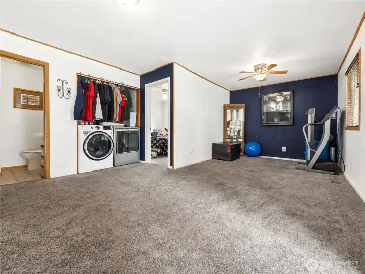 Family room with 4th bedroom half bath and laundry