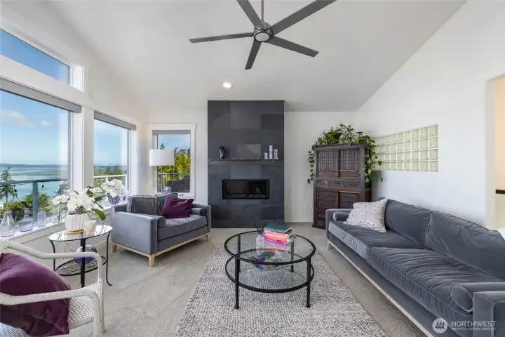 The living room has a commanding view of Port Susan, Camano Island, and the Olympics.  Vaulted ceiling and plenty of windows let in tons of natural light.