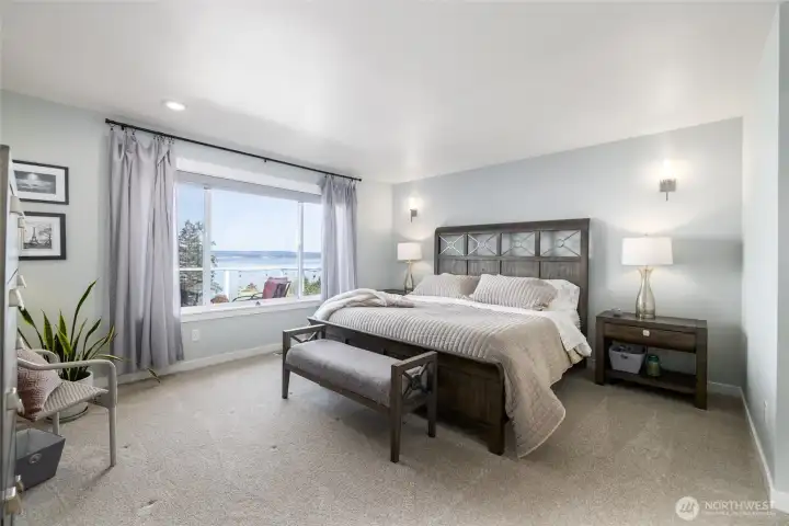 Imagine waking up to those views every morning...and falling asleep to them every night.  Spacious primary suite has new flooring, paint, trim, and a walk-in closet and private ensuite bath.