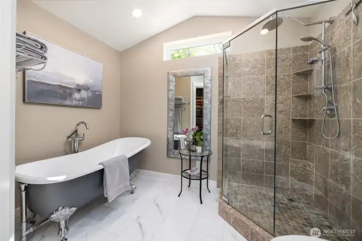 The primary ensuite includes tile floor, oversized tile shower, cast iron clawfoot tub.
