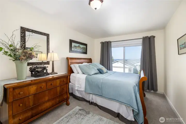 Main floor guest bedroom #1, with water views.