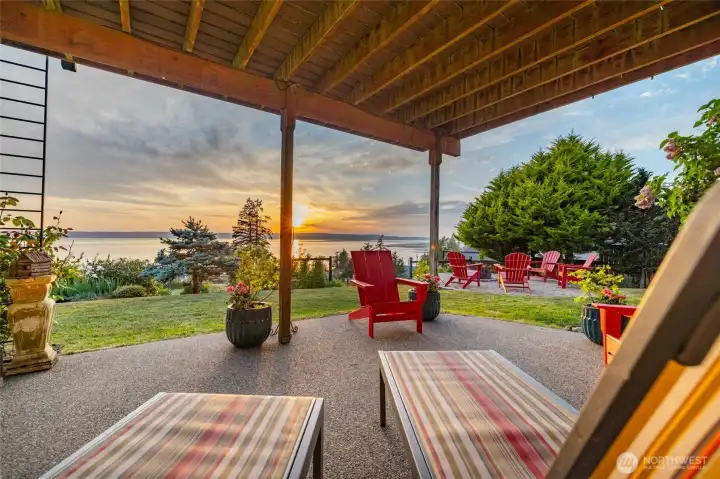The property enjoys multiple outdoor living spaces for entertaining or simply for relaxing and enjoying the sunsets and beautiful water views.