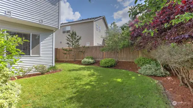 Plenty of lawn and flower bed space throughout this yard.