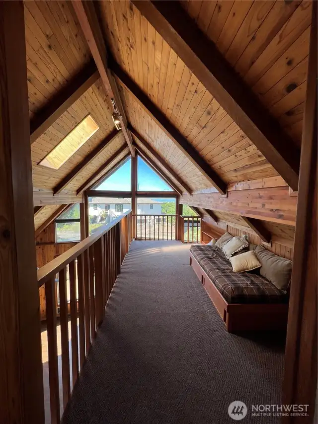 At the top of the stairs is a loft with day bed and amazing view...