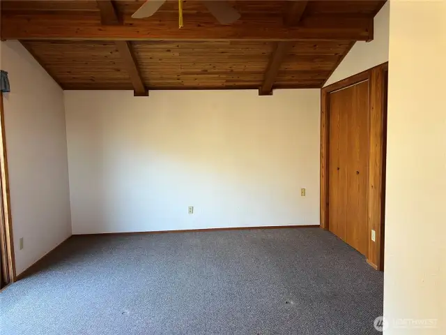 Large Primary Bedroom with wonderful wood ceilings and double closest.