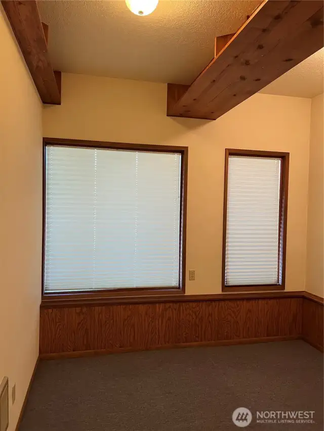 Office with additional shelving space on ground floor.