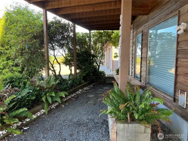 In front of house, path to both double garage and enclosed hot tub.