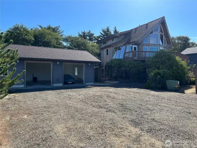 This shows the large double lot with home and detached garage building.