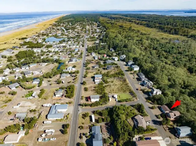 This is the view of the Pacific Ocean merging with Willapa Bay. The home is noted by the red arrow. Life is good at the beach.