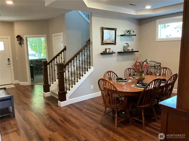 Note the lush flooring throughout the main floor.  Formal dining to the right and home office or den on the other side of the staircase