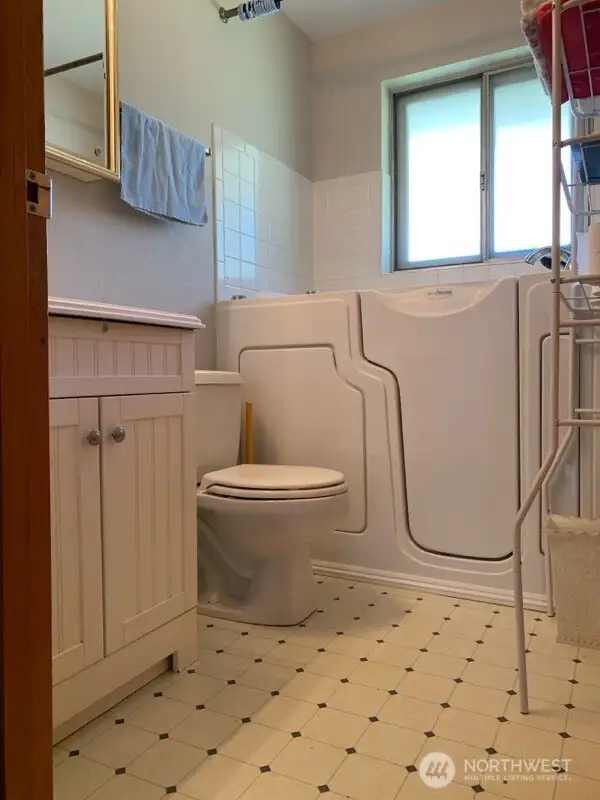 Bathroom with walk in jetted tub and shower