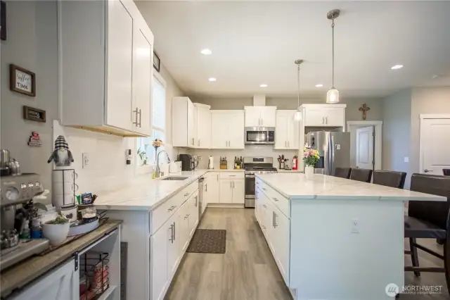 amazing kitchen with quartz countertops and oversized island