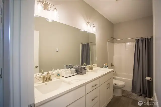 guest bathroom with double sink vanity