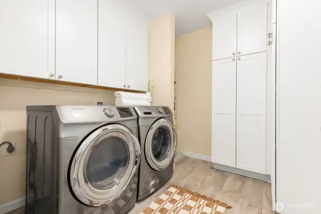 Utility room in a condo? Yes, we've got that.  No sliding doors or curtains here.  Newer Samsung washer and dryer, plenty of storage in your custom cabinets