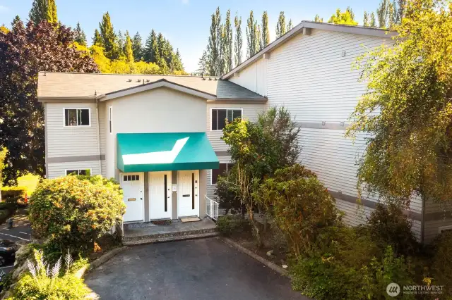 Exterior Photo of your unit.  This building is 3 stories, but #B20 (far right) is main level entry - no going up or down once you walk through the front door