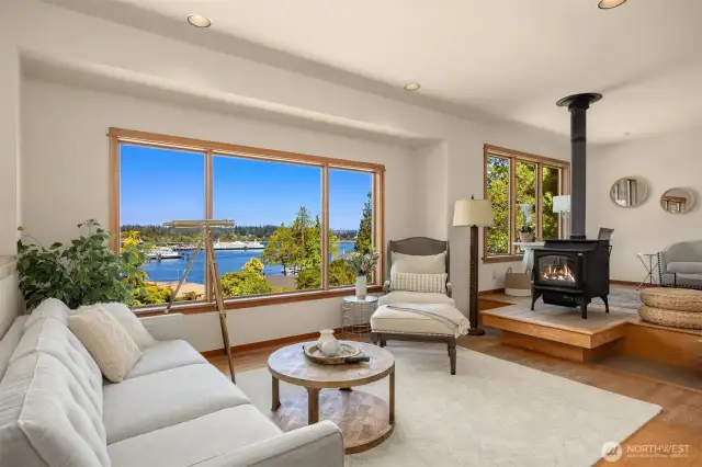Light filled open living room with wood burning fireplace