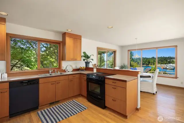 Open concept kitchen with clear fir cabinets