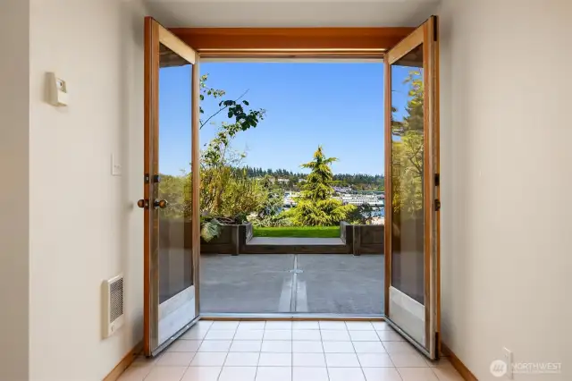 Downstairs exterior entry with french doors that open out to the yard.