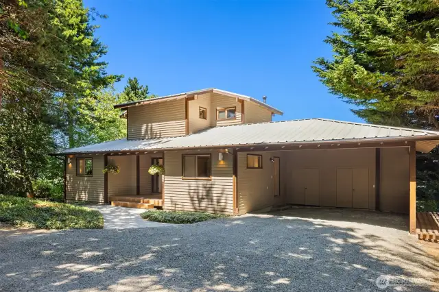 Front entrance to the home with attached carport and storage area.