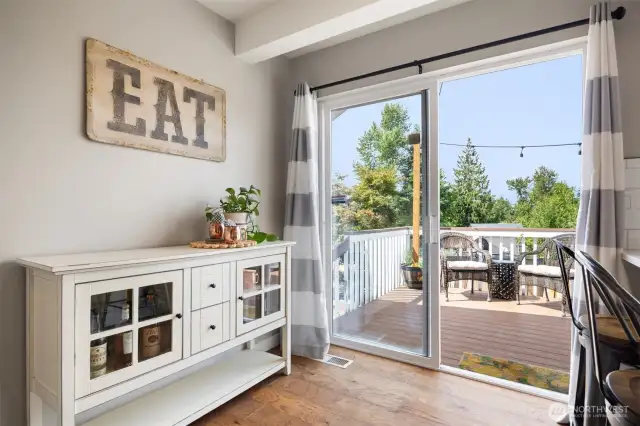 The sliding glass doors to the upper deck make for perfect alfresco dining, and let in an abundance of natural lighting.