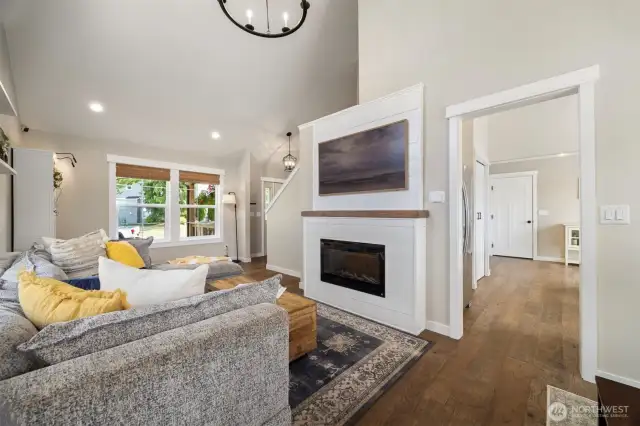 The vaulted ceilings bring in an abundance of natural lighting, and the fireplace creates a perfect setting for cozy nights.