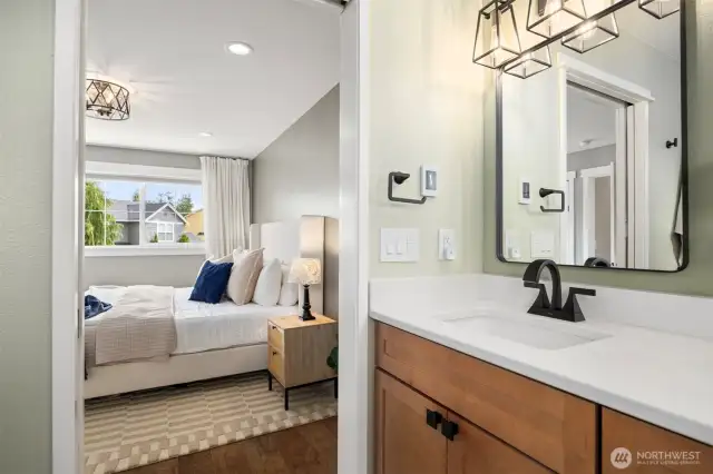 View into the primary bedroom from the primary bath.
