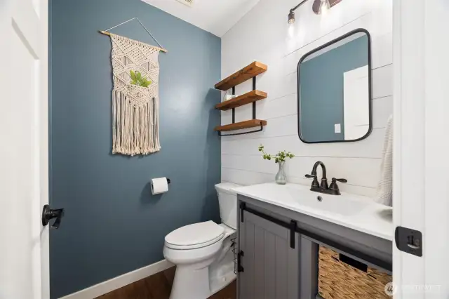 The main level powder bath is perfect for guests and has been tastefully updated to match the modern homeowner!