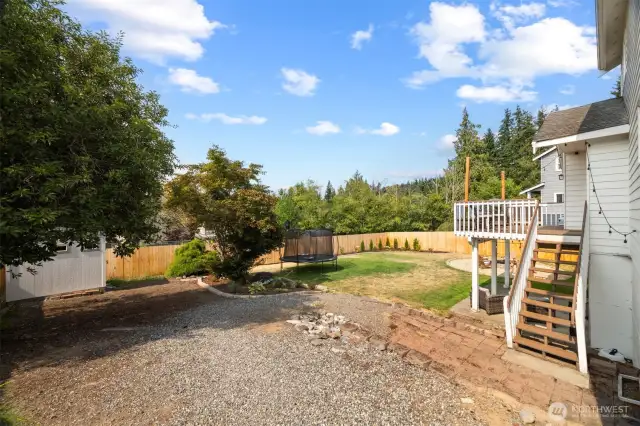 The home includes the storage shed on the left and a fully fenced in yard.